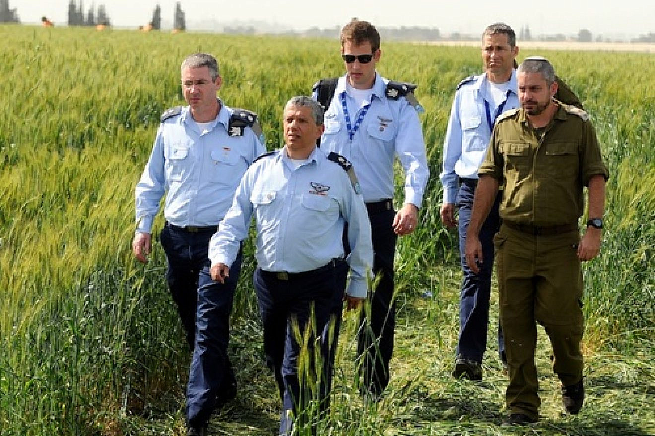 Click photo to download. Caption: Israel Air Force Commander Major General Amir Eshel (front) investigating the accident in which two Air Force pilots were killed in an Israeli military helicopter crash in the Revadim area south of Gedera on Tuesday, March 12. Credit: Yossi Zeliger/Flash90
