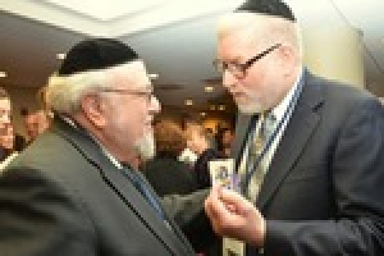 Click photo to download. Caption: Rabbi Aryeh Scheinberg (left) raises a question to Rabbi Pesach Lerner at the CUFI (Christians United for Israel) emergency lobbying session against the nomination of Chuck Hagel for defense secretary in Washington, DC, Jan. 28. Credit: Maxine Dovere.