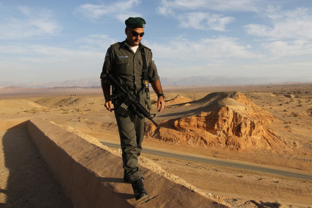 An Israeli Border Policeman patrols the area of the Judean Desert near the Jordan border. Photo by Nati Shohat/Flash90.