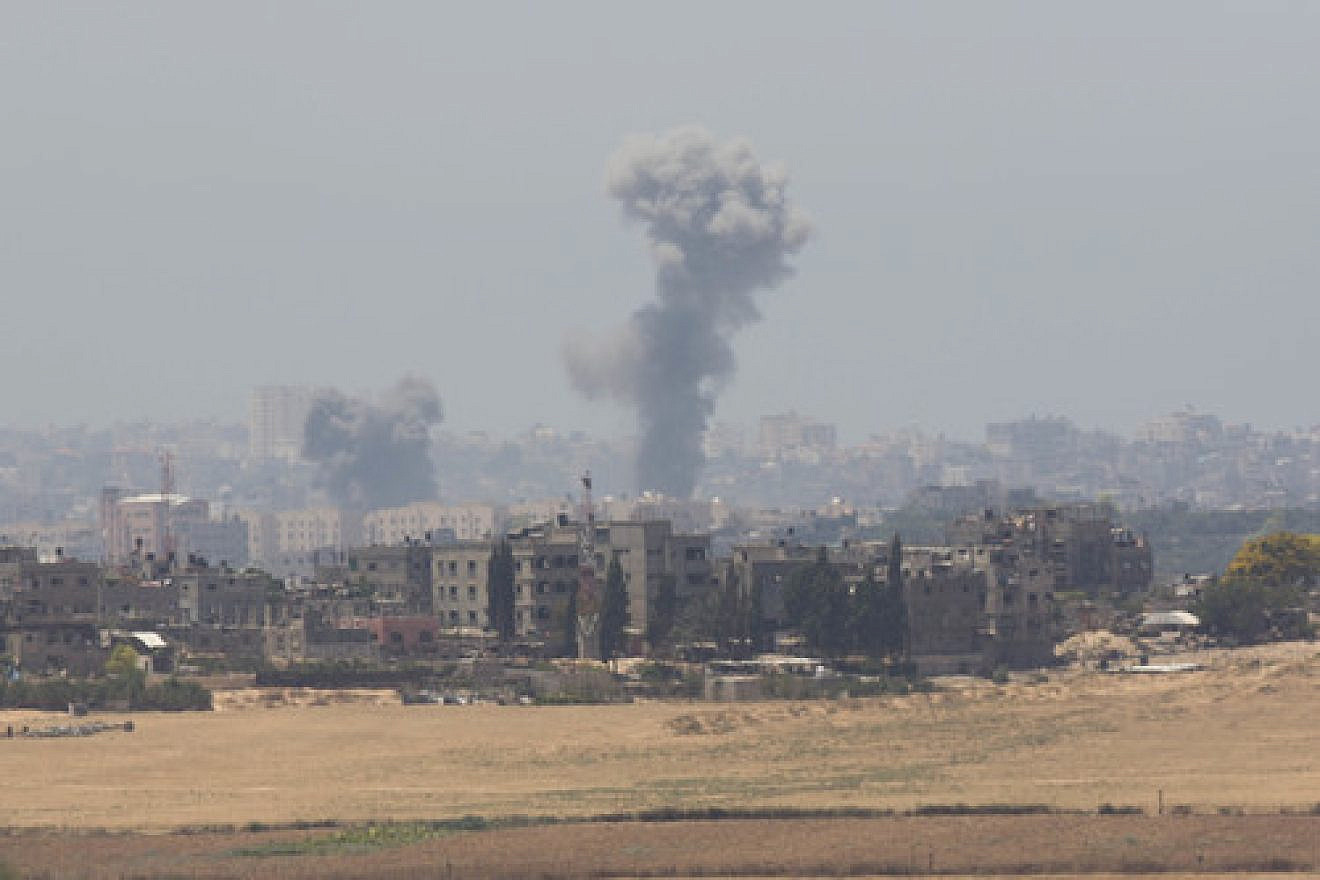 Smoke rises in Gaza after an Israeli airstrike on the second day of “Operation Protective Edge,” July 9, 2014. Credit: Yonatan Sindel/Flash90.