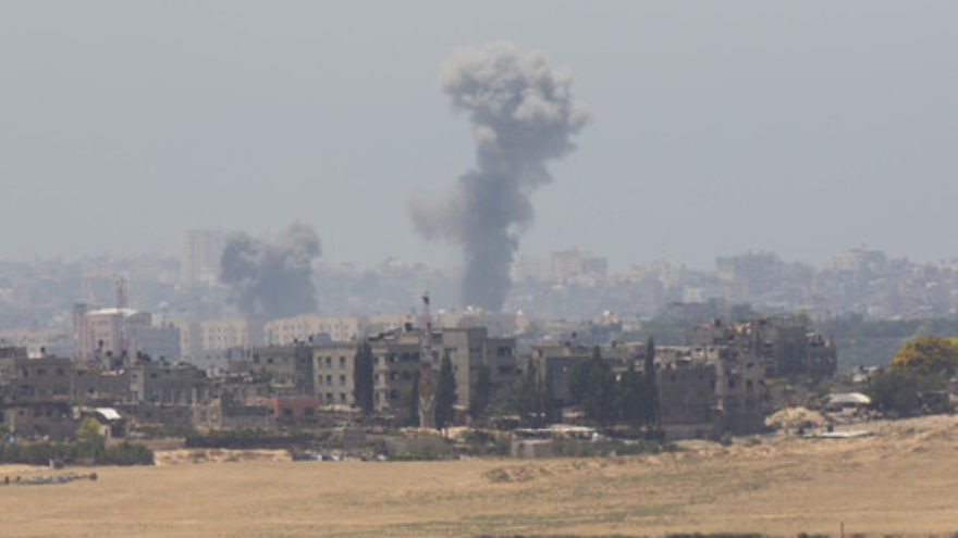 Smoke rises in Gaza after an Israeli airstrike on the second day of “Operation Protective Edge,” July 9, 2014. Credit: Yonatan Sindel/Flash90.