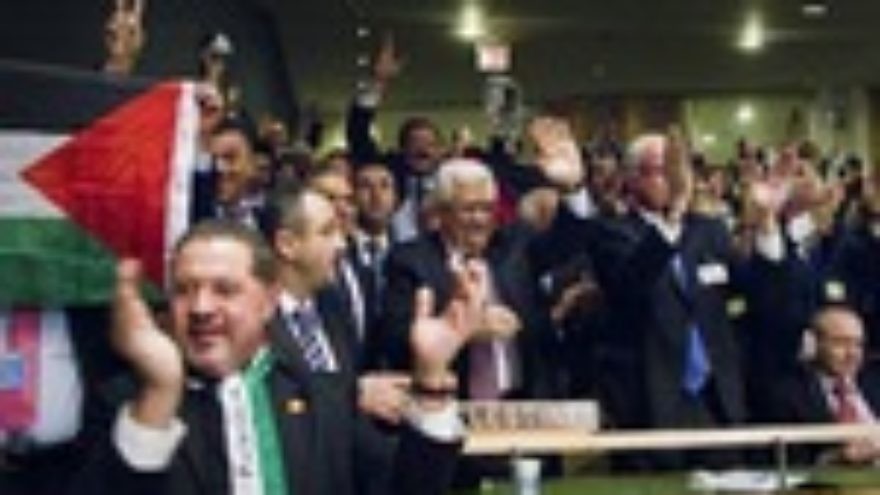 Click photo to download. Caption: Members of the Palestinian delegation at the United Nations General Assembly celebrate Nov. 29 upon the vote to upgrade Palestinian status to a non-member observer state Nov. 29. Credit: UN Photo/Rick Bajornas.