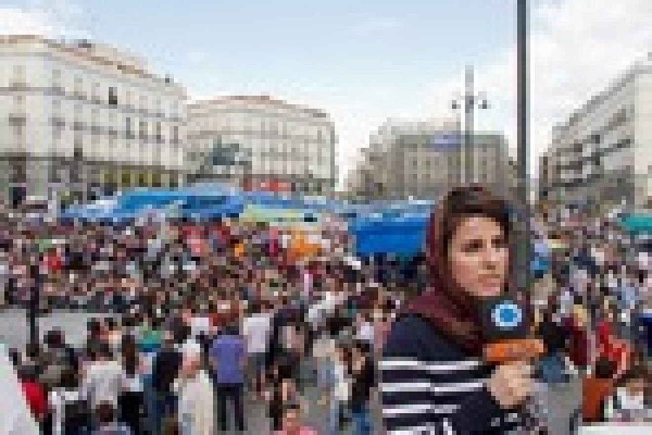 Sonia Labboun, correspondent of Iranian Press TV in Puerta del Sol, Madrid, during the Spanish protests in May 2011. Credit: Kadellar/Wikimedia Commons.