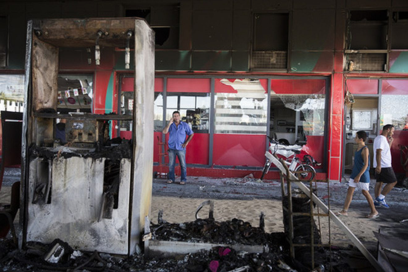 Click photo to download. The scene of a gas station in Ashdod that was hit directly by rocket fire from Gaza on the fourth day of Operation Protective Edge, July 11, 2014. Credit: Hadas Parush/Flash90.