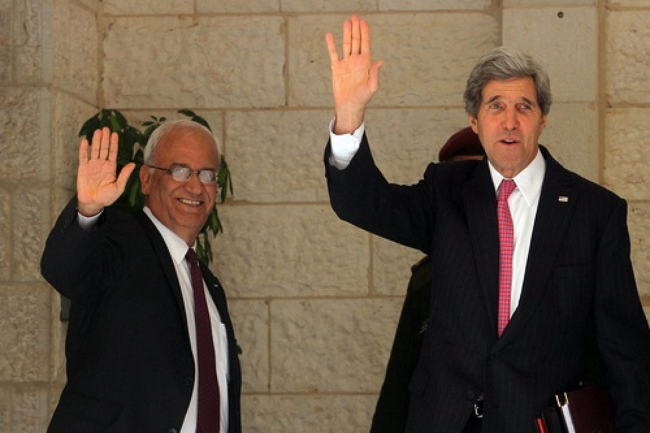 U.S. Secretary of State John Kerry and chief Palestinian negotiator Saeb Erekat wave before a meeting with Palestinian Authority leader Mahmoud Abbas in Ramallah on Jan. 4, 2014. After recent developments, all parties involved may soon be waving goodbye to the Israeli-Palestinian peace negotiations, which have an April 29 deadline for a resolution. Credit: Issam Rimawi/Flash90.