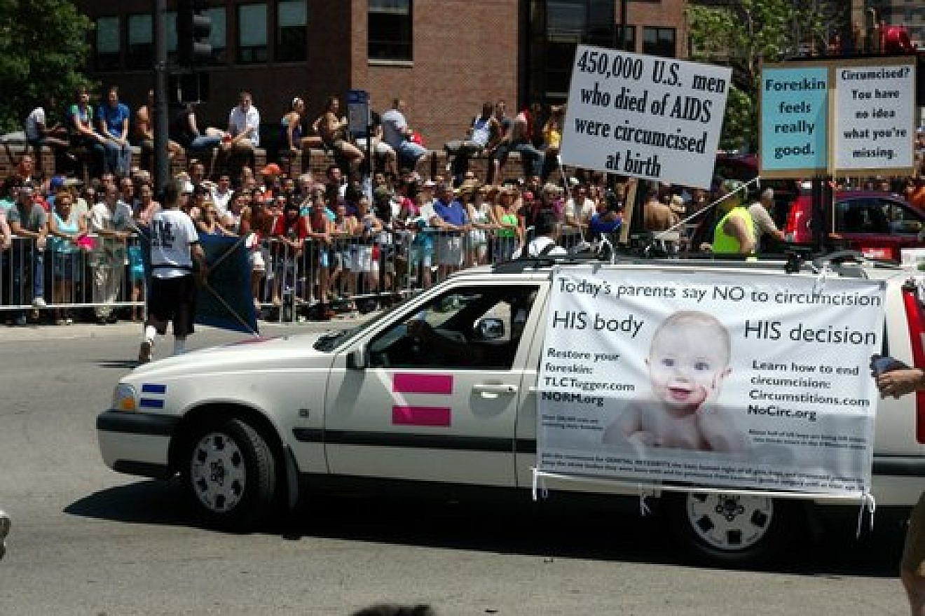 Click photo to download. Caption: A protest against circumcision in Chicago. Credit: Andrew Ciscel via Wikimedia Commons