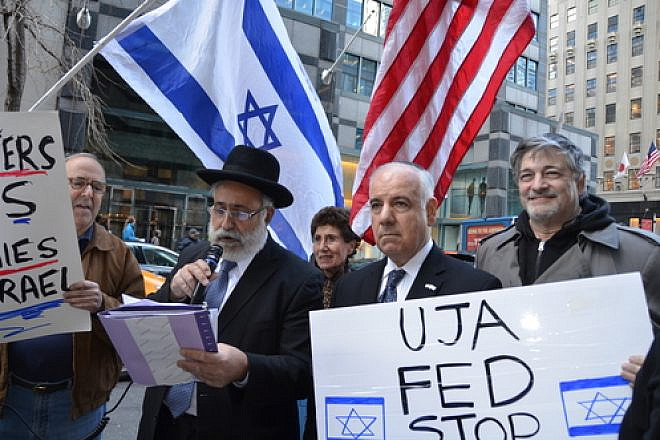 On April 8, 2014, a rally in New York City against what protesters called the inclusion of "pro-BDS (Boycott, Divestment and Sanctions) groups" in the annual Celebrate Israel Parade. Holding the microphone is Israeli Member of Knesset Nissim Ze’ev (Shas). Credit: Maxine Dovere.