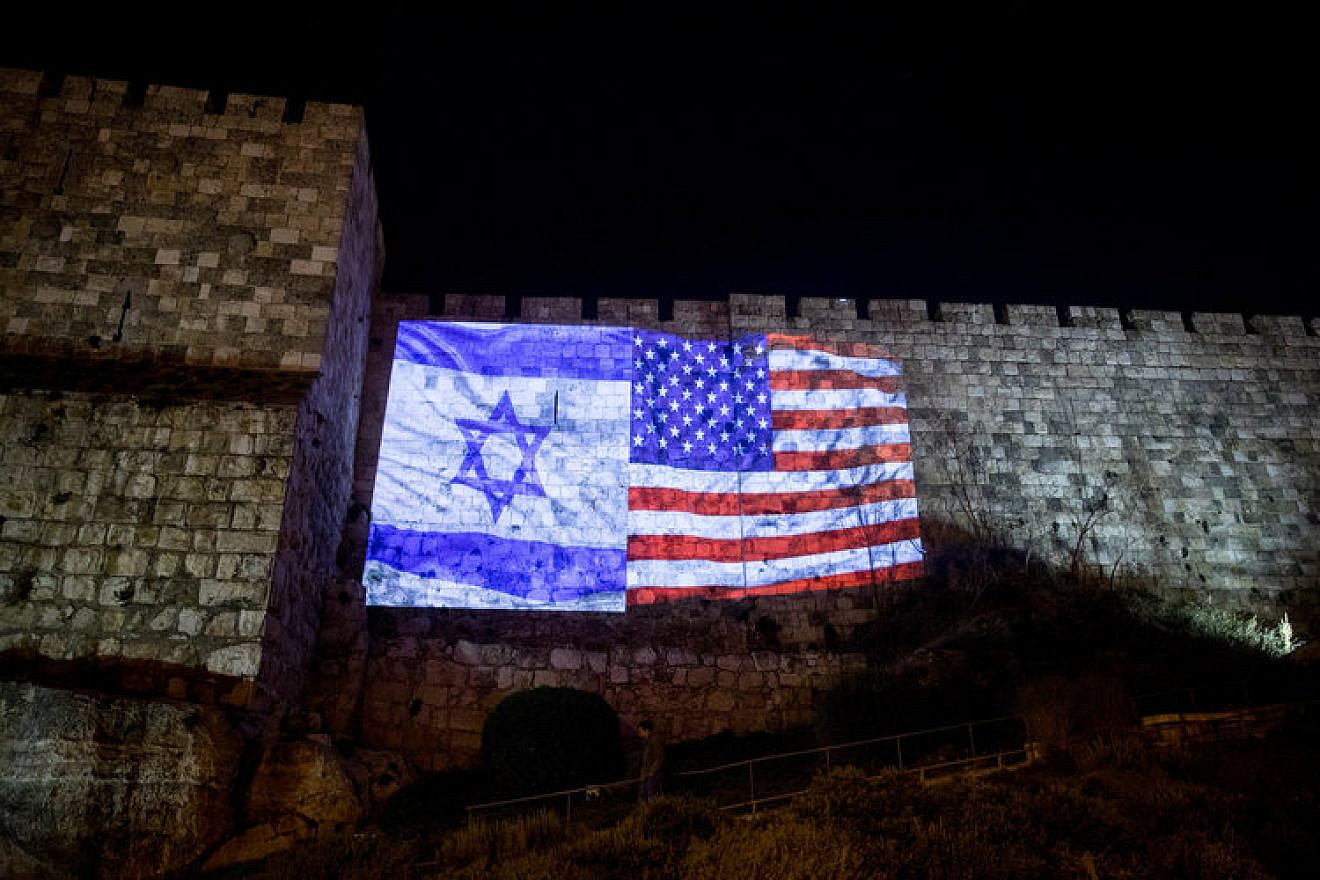 Images of Israeli and American flags projected onto the walls of the Old City of Jerusalem following the recognition of Jerusalem as Israel's capital. Credit: Yonatan Sindel/Flash90.