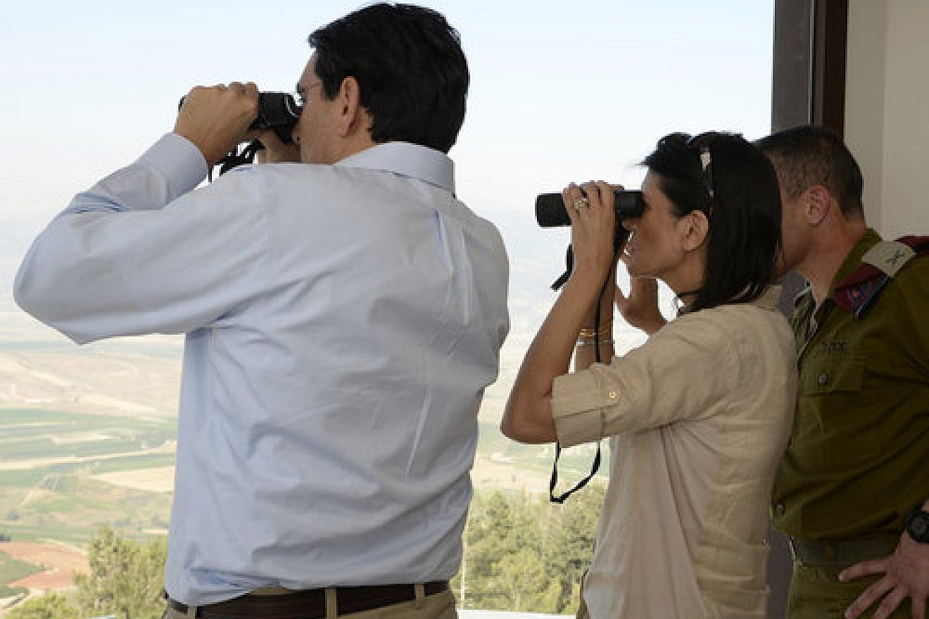 During a visit to northern Israel in June 2017, Israeli Ambassador to the United Nations Danny Danon (left) and U.S. Ambassador to the U.N. Nikki Haley (center) look out over southern Lebanon. Credit: Matty Stern/U.S. Embassy Tel Aviv/Flash90.