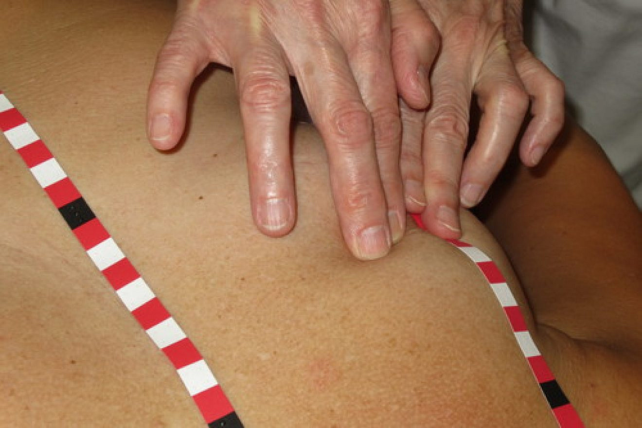The Medical Tactile Examiners (MTEs) use self-adhesive stripes with tactile orientation points to identify abnormalities in the breast. Credit: Dr. Frank Hoffmann, Discovering Hands.