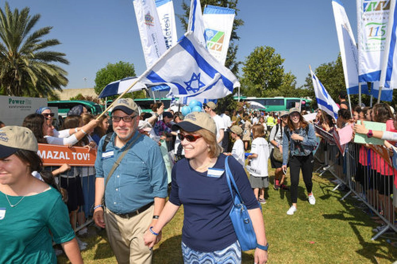 In front, the Lankin family from Highland Park, N.J., upon landing in Israel July 4, 2017, on a chartered flight through the Nefesh B'Nefesh aliyah agency. Credit: Shahar Azran, courtesy of Nefesh B’Nefesh.