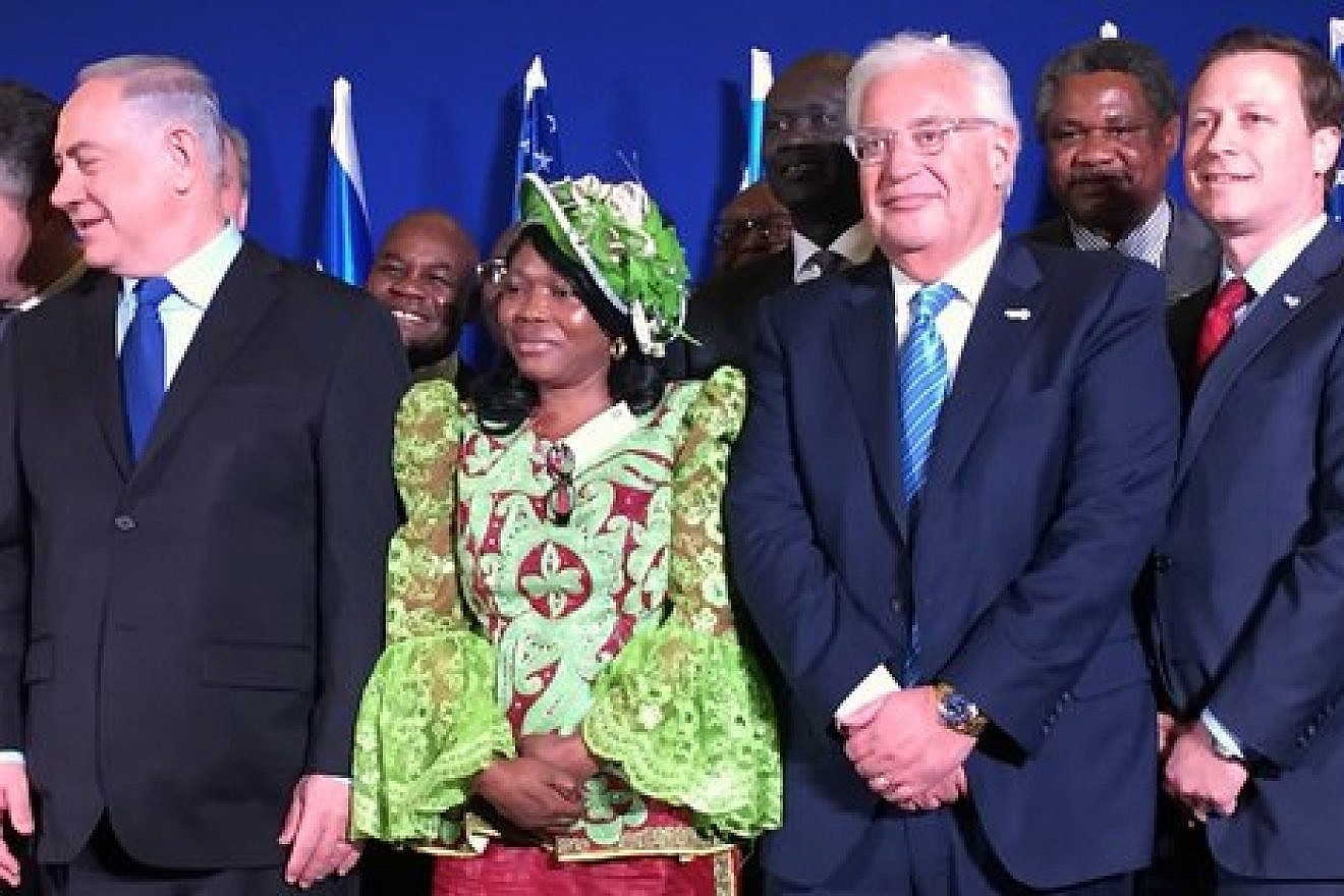 In front, Israeli Prime Minister Benjamin Netanyahu (left), U.S. Ambassador to Israel David Friedman (third from left) and Power Africa initiative Coordinator Andrew Herscowitz (right) attend the Dec. 4 signing of a memorandum of understanding on Israel's entrance into Power Africa. Credit: Alex Traiman.