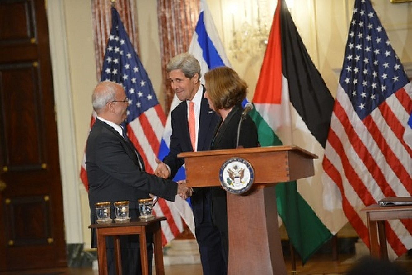 U.S. Secretary of State John Kerry (center), Israeli Justice Minister Tzipi Livni and Palestinian chief negotiator Saeb Erekat shake hands after addressing reporters on the subject of Israeli-Palestinian peace talks at the U.S. Department of State in Washington, D.C., in July 2013. Credit: U.S. State Department.