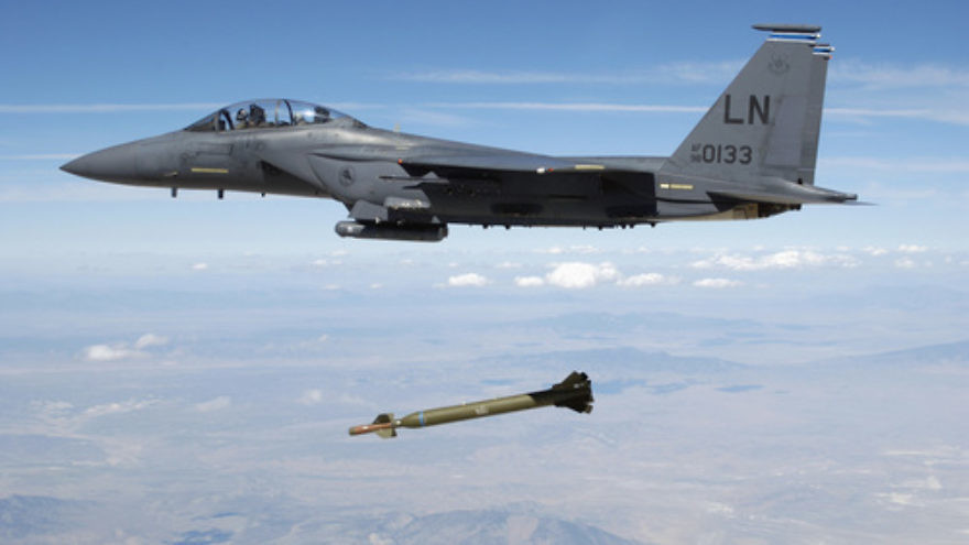 A U.S. Air Force F-15E Strike Eagle aircraft releases a GBU-28 ”bunker buster” 5,000-pound laser-guided bomb over the Utah Test and Training Range. Credit: TSGT Michael Ammons, USAF via Wikimedia Commons.