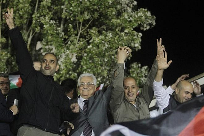 Palestinian Authority leader Mahmoud Abbas (second from left) waves with Palestinian prisoners released from Israeli jails during celebrations in Ramallah, Oct. 30, 2013. Photo by Issam Rimawi/Flash90.