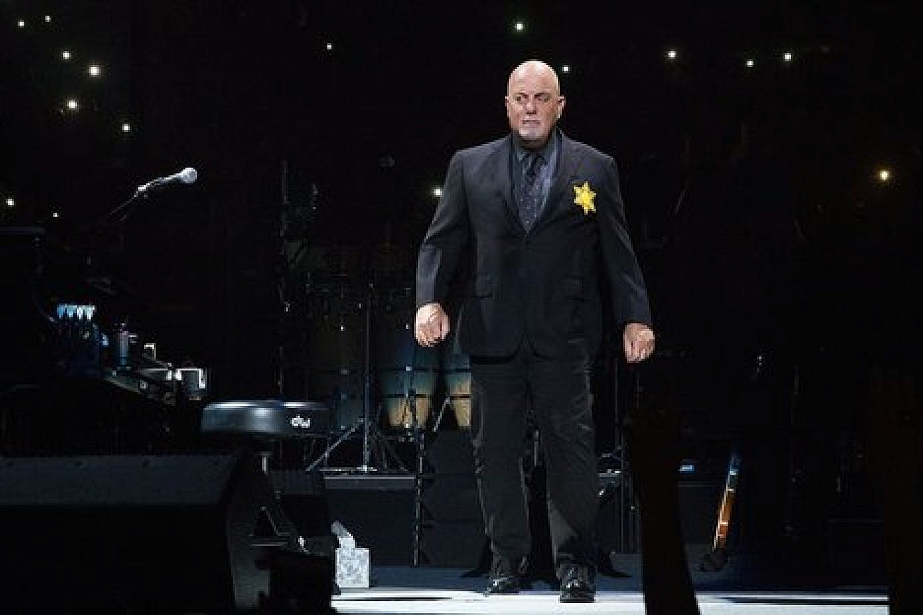 Billy Joel sports a yellow star on his jacket during a concert at New York City’s Madison Square Garden. Credit: Billy Joel via Twitter.