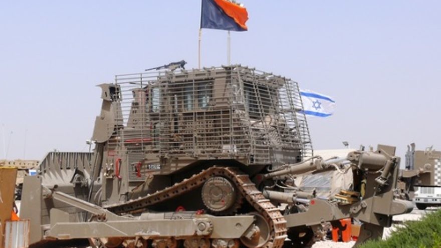 An IDF Caterpillar D9. At its 2014 General Assembly, Presbyterian Church USA targeted Caterpillar for its resolution to divest from Israel because Israel allegedly “weaponizes” Caterpillar tractors—a misnomer for the fact that Israel puts armor on them to protect operators from IEDs (improvised explosive devices) and other attacks—and because its tractors are used to build the West Bank security fence, write Roberta P. Seid and Roz Rothstein. Credit: MathKnight via Wikimedia Commons.