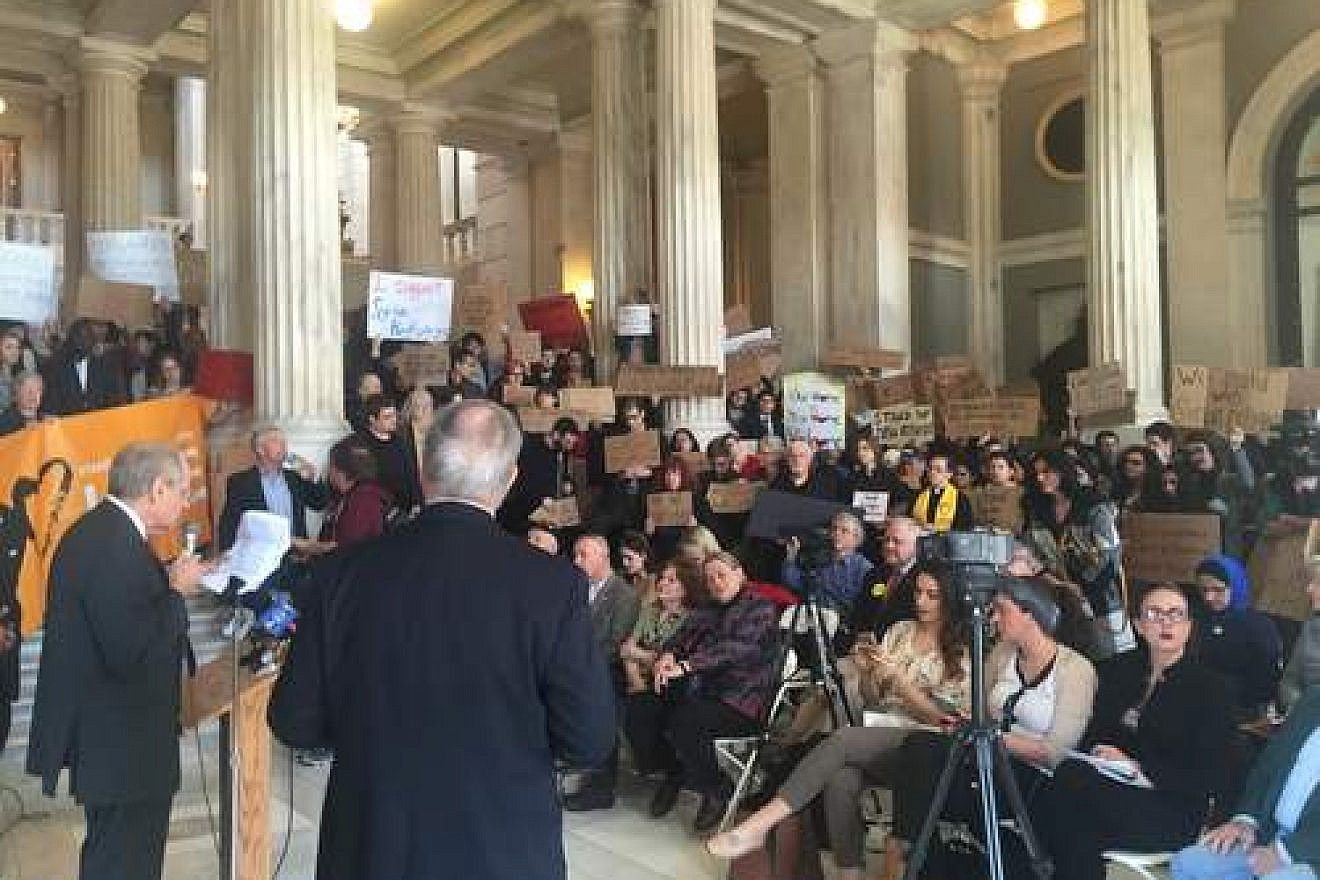 Dr. Charles Jacobs (left, at podium) speaks out against Syrian refugee absorption on Monday at the Rhode Island State House. Credit: Courtesy Americans for Peace and Tolerance.