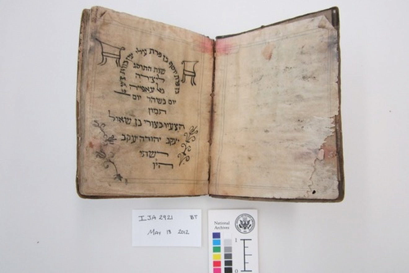 Before treatment by the National Archives and Records Administration, this Passover Haggadah from 1902 was recovered from the Mukhabarat, Saddam Hussein’s Intelligence Headquarters. It's part of what has become known as the Iraqi Jewish Archive. Credit: National Archives and Records Administration.