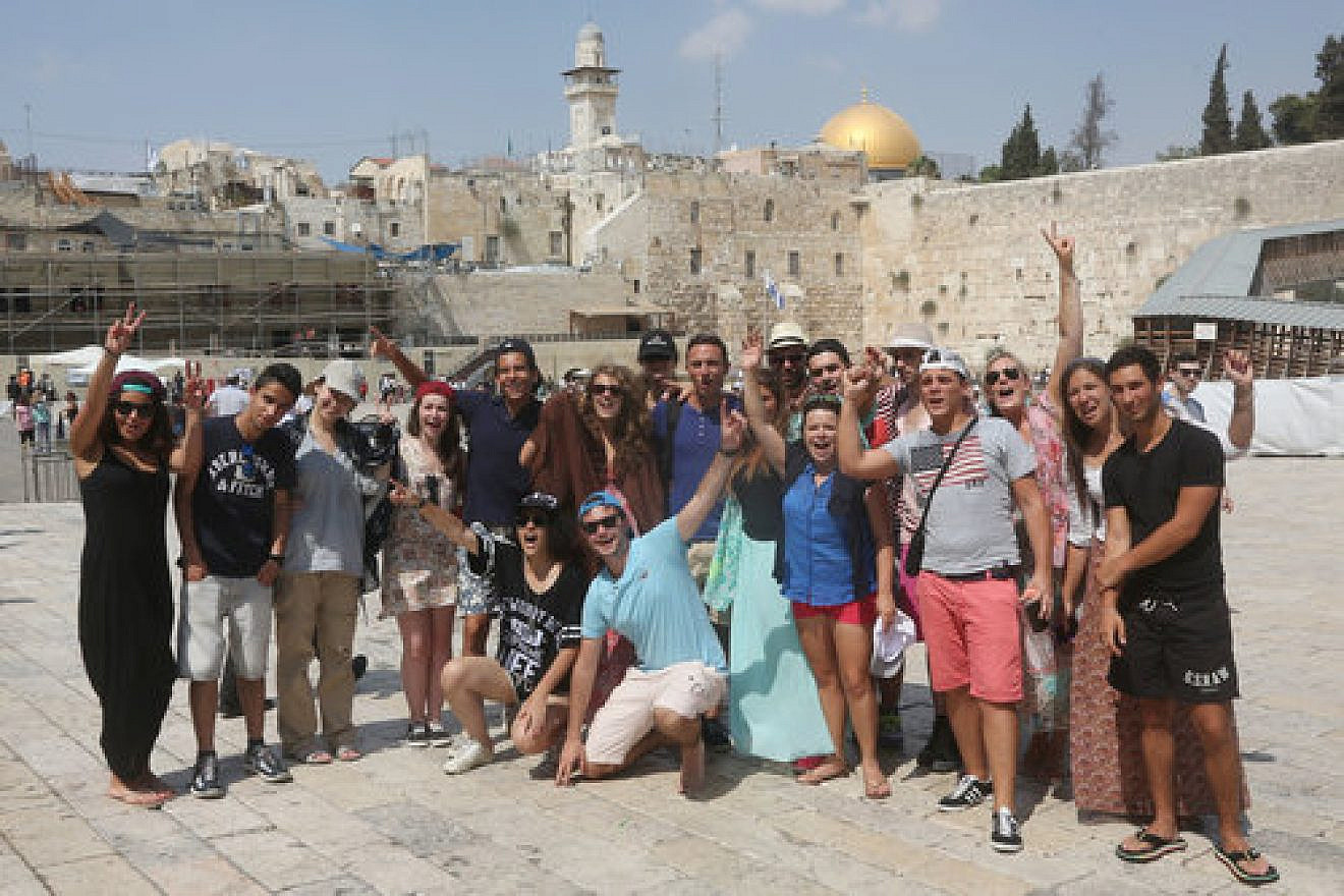 Taglit-Birthright Israel trip participants visit the Western Wall in the Old City of Jerusalem, Aug. 18, 2014. This photo was published with a recent news report on a J Street-driven letter, in which 575 Jewish students stated that Birthright has a policy of not traveling to “the West Bank.” Photo by Flash90.