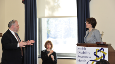 William Daroff (pictured at left), senior vice president for public policy at the Jewish Federations of North America, speaks to U.S. Rep. Cathy McMorris Rodgers (R-Wash., pictured at the podium) during Jewish Disability Advocacy Day in 2013. Credit: The Jewish Federations of North America.