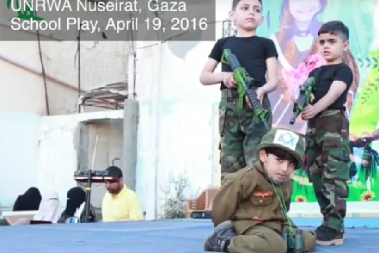 A school play performed at the UNRWA Nuseirat School in Gaza, in which students hold an Israeli hostage at gunpoint, April 2016. Credit: Center for Near East Policy Research.