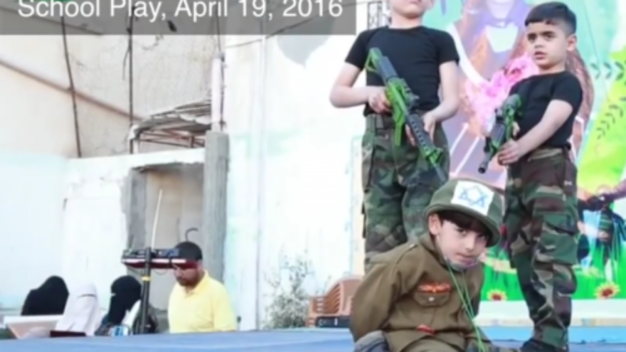 A military-themed school play held in April 2016 at the UNRWA Nuseirat School in Gaza, in which students hold an Israeli hostage at gunpoint. Credit: Center for Near East Policy Research.
