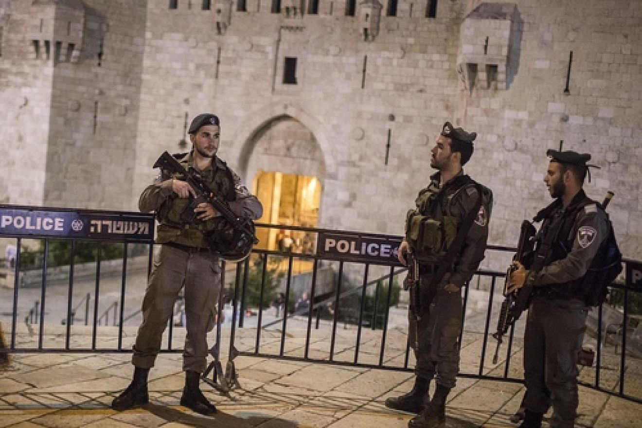 Click photo to download. Caption: Israeli Border Police officers guard at the Damascus Gate as security forces shut down Jerusalem's Old City while searching for a suspect following a stabbing attack on May 2, 2016. Credit: Hadas Parush/Flash90.