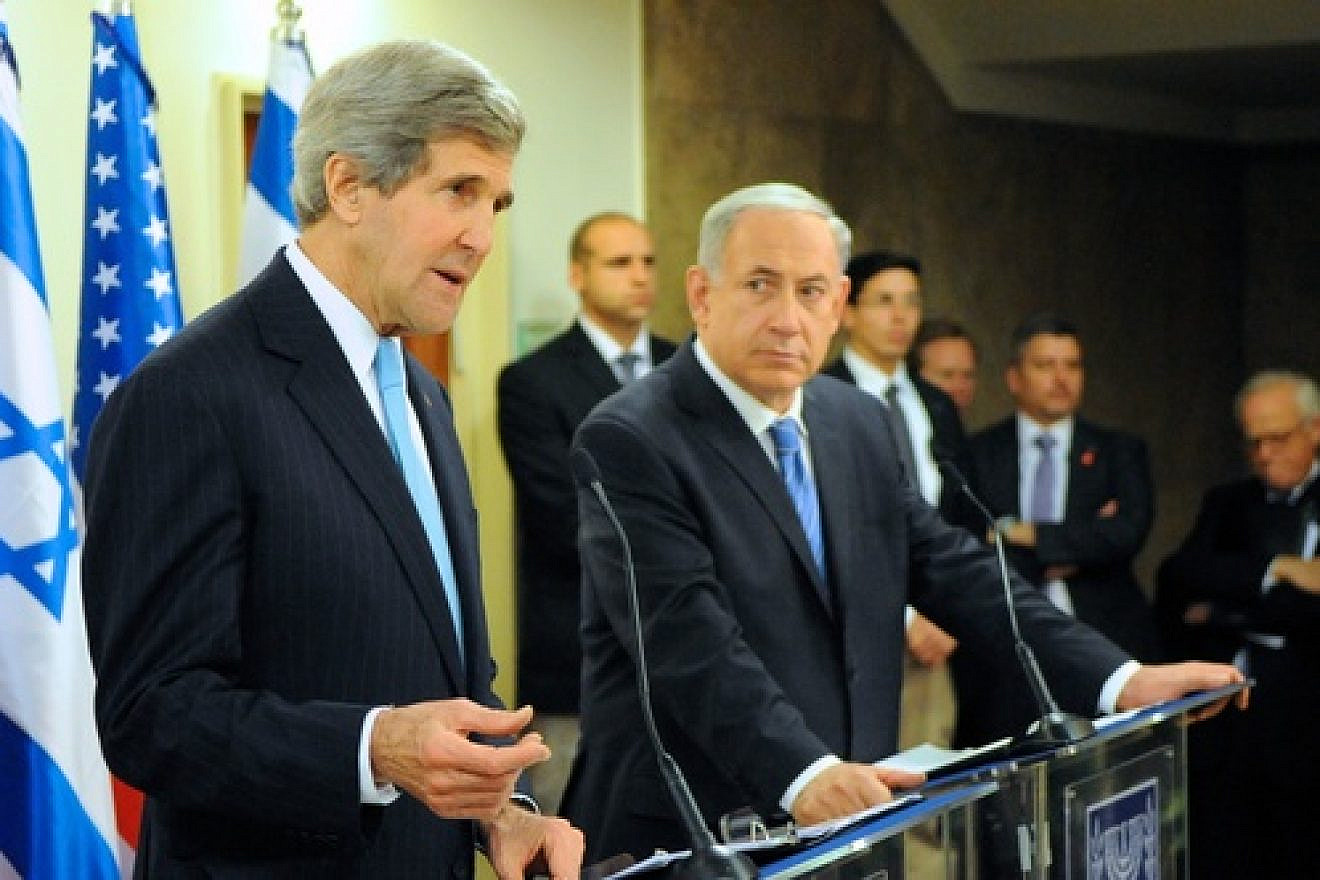 Israeli Prime Minister Benjamin Netanyahu looks on as U.S. Secretary of State John Kerry addresses reporters before a series of meetings at the Prime Minister's office in Jerusalem on January 2, 2014. Kerry recently came under fire for saying that Israel could become an "apartheid state" if a two-state solution is not reached soon. Credit: U.S. State Department.