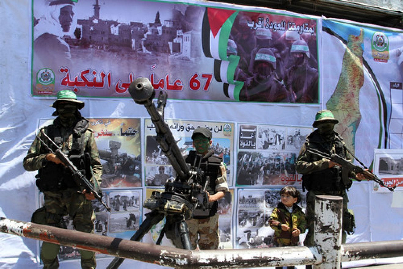 Hamas terrorists participate in a militaristic rally against Israel in the southern Gaza Strip on May 17, 2015. With the emergence of Islamic State supporters in Gaza, Hamas has a new rival in the territory in governs. Credit: Abed Rahim Khatib/Flash90.