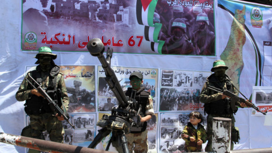 Click photo to download. Caption: Hamas terrorists participate in a militaristic rally against Israel in the southern Gaza Strip on May 17, 2015. With the emergence of Islamic State supporters in Gaza, Hamas has a new rival in the territory in governs. Credit: Abed Rahim Khatib/Flash 90.