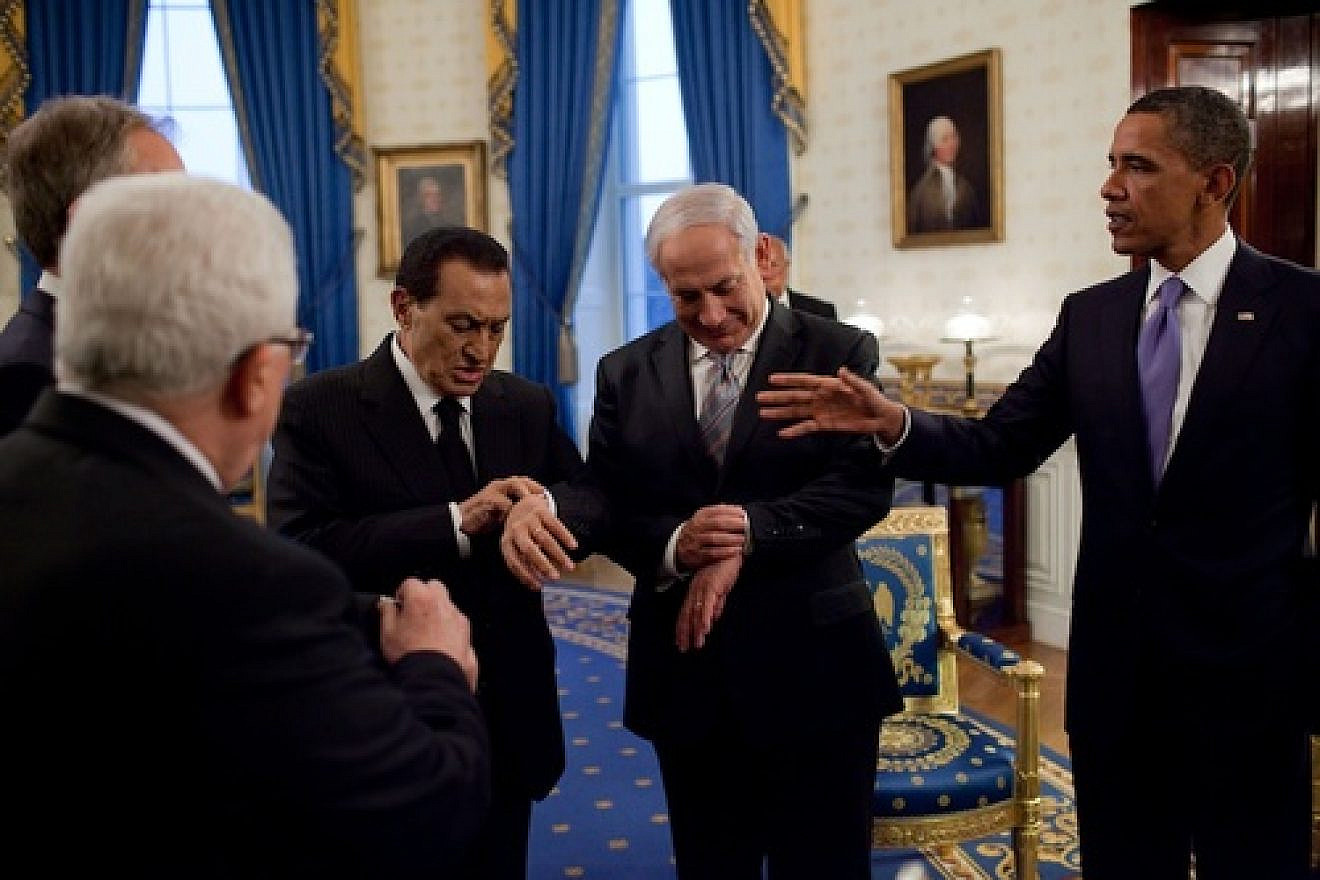 Click photo to download. Caption: President Barack Obama (far right) with Israeli Prime Minister Benjamin Netanyahu and then Egyptian President Hosni Mubarak—both checking their watches—in September 2010 at the White House. Credit: White House.