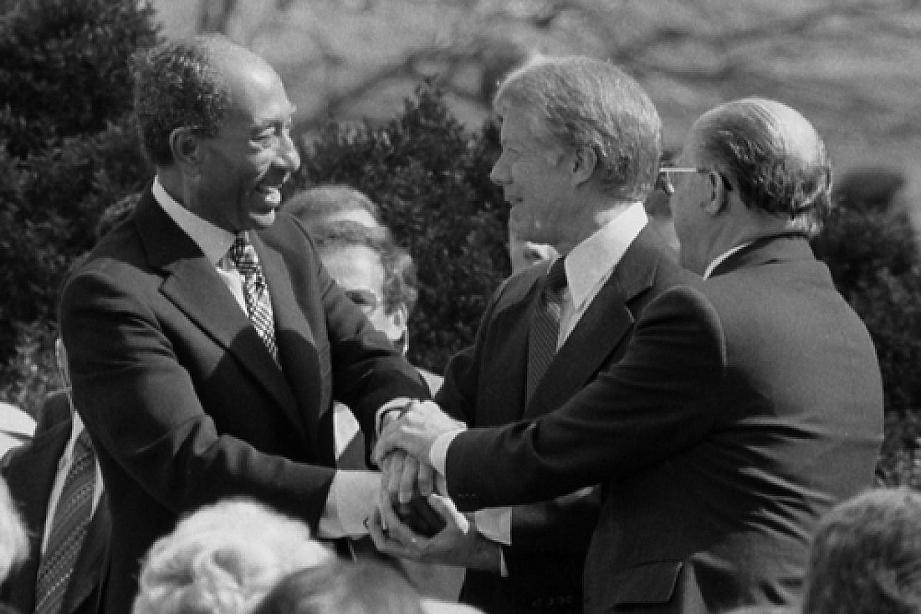 From left: Egyptian President Anwar Sadat, U.S. President Jimmy Carter and Israeli Prime Minister Menachem Begin at the White House for the signing of the 1979 Egypt-Israel peace treaty. A photo of the peace treaty's signing was added to the new edition of “The Geography of the Arab World and the History of Modern Egypt,” a ninth-grade Egyptian textbook. Credit: Warren K. Leffler via Wikimedia Commons.