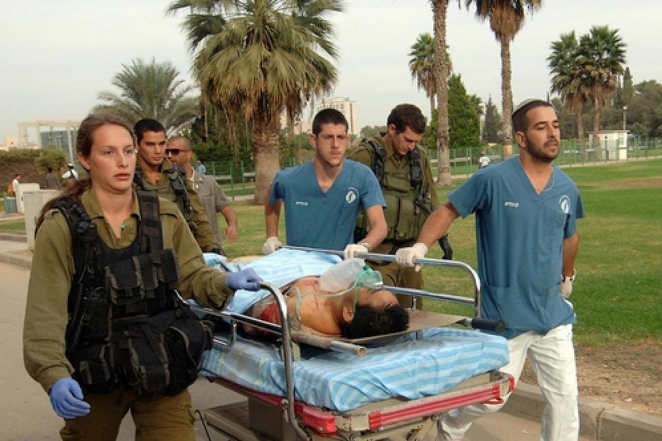 Click photo to download. Caption: Medics carry a man wounded by a mortar shell fired from the Gaza Strip, for treatment in Soroka hospital in Beersheba, southern Israel, Wednesday, Oct. 24, 2012. Credit: Dudu Greenspan/Flash90.