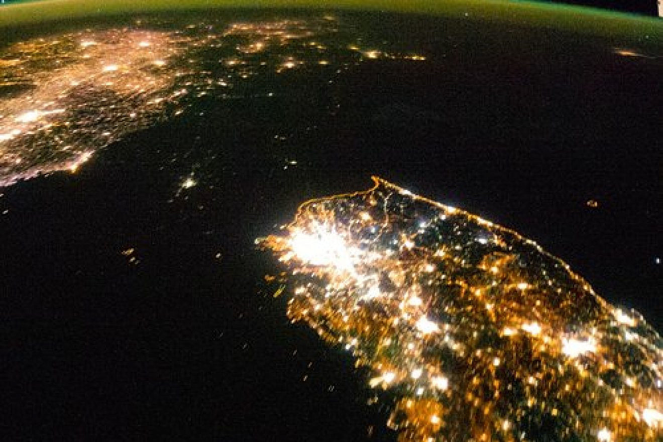 Satellite images like this one illustrate the nature of the North Korean regime, writes columnist Ben Cohen. While South Korea (bottom) sparkles brightly, North Korea (center) is shrouded in pitch black darkness—save for a small glimmer around Pyongyang, the capital, where the officials of the ruling party are quartered, and which is spared, relatively speaking, from the famine and electricity shortages that prevail in the rest of the country. Credit: NASA.