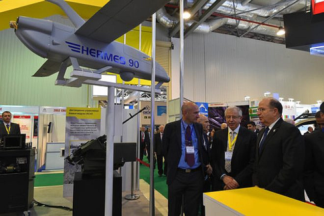 Click photo to download. Caption: Israeli Defense Minister Moshe Ya'alon (pictured at right) unveiled the Israeli stall at the Adex 2014 International Defense Industry Exhibition in Azerbaijan on Sept. 11, 2014. Ya'alon's trip marked the first official state visit to Azerbaijan by an Israeli defense minister. Credit: Ariel Hermoni/Ministry of Defense/Flash90.