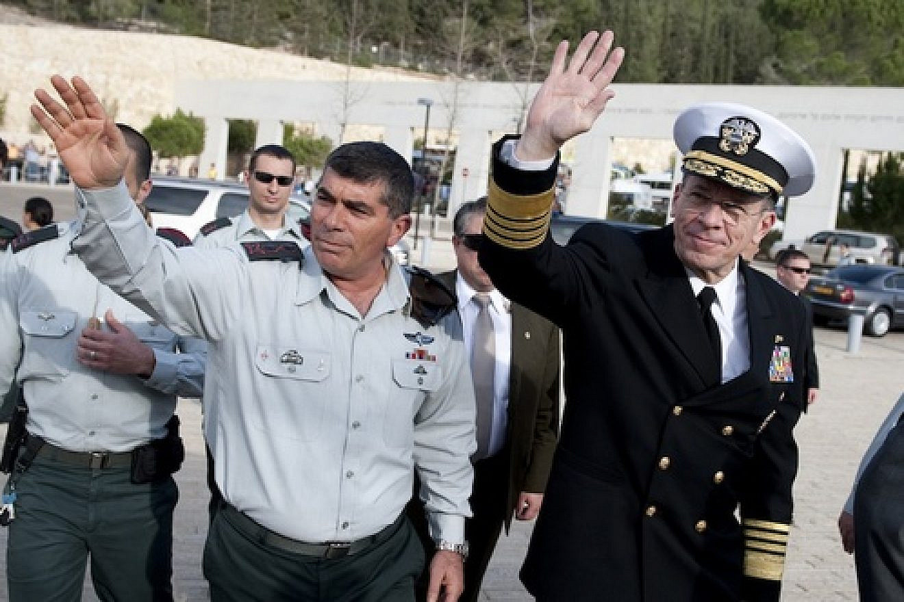 Click photo to download. Caption: Israeli Defense Forces Lt. Gen. Gabi Ashkenazi and Chairman of the Joint Chiefs of Staff Adm. Mike Mullen, U.S. Navy, wave to onlookers at the Yad Vashem Holocaust Memorial Museum in Jerusalem on Feb. 15, 2010. Credit: U.S. Navy.