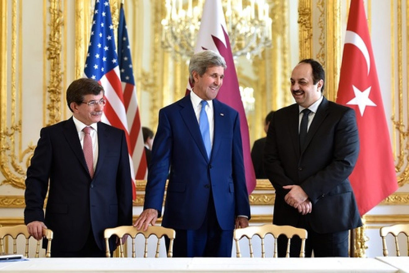 On July 26, 2014, (from left to right) Turkish Foreign Minister Ahmet Davutoğlu, U.S. Secretary of State John Kerry, and Qatari Foreign Minister Khalid bin Mohammad Al Attiyah hold a trilateral meeting in Paris focused on reaching a cease-fire deal for the Gaza conflict. JNS.org columnist Ben Cohen asks: Should we continue ignoring Qatari and Turkish backing of Hamas for the sake of a successful campaign against Islamic State? Credit: State Department.