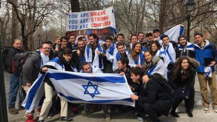 In late March, Mendy Boteach (son of media personality Rabbi Shmuley Boteach) and about 20 of his fellow New York University students positioned themselves near the “Israeli Apartheid Wall” in Washington Square Park with a 10-foot sign quoting Lady Gaga lyrics, reading, “You are brave, you are strong, you are confident, and I f***ing love you Israel.” Credit: Courtesy Rabbi Shmuley Boteach.
