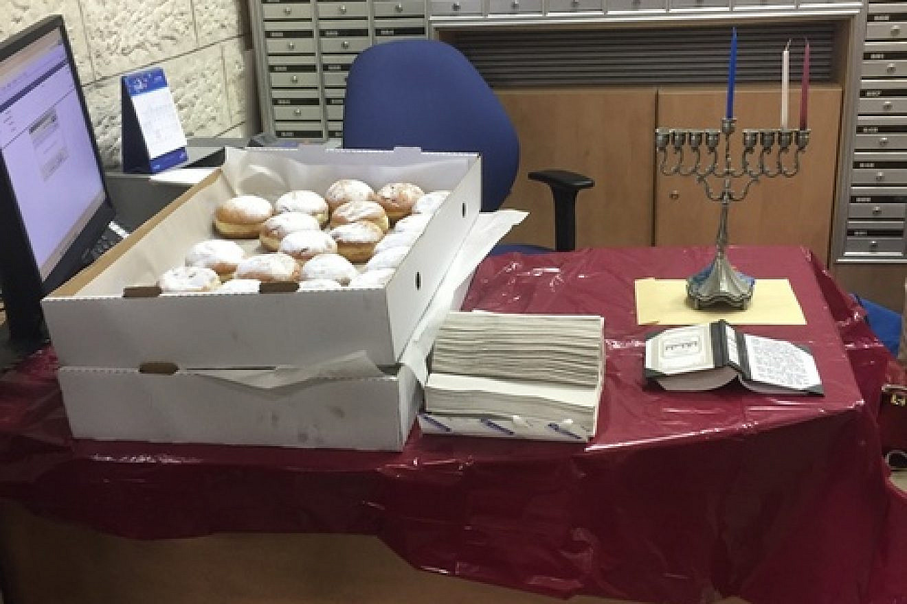 Click photo to download. Caption: Eliana Rudee's Hanukkah miracle story—sufganiyot) jelly donuts at the bank in Israel. Credit: Eliana Rudee.