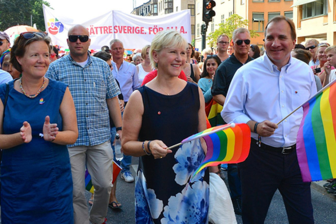Click photo to download. Caption: Swedish Foreign Minister Margot Wallstrom (front, center) and Swedish Prime Minister Stefan Lofven (front, right)—both of whom have recently made controversial remarks on the Israeli-Palestinian conflict—march in an LGBT pride parade in Stockholm in August 2014. Credit: Frankie Fouganthin via Wikimedia Commons.