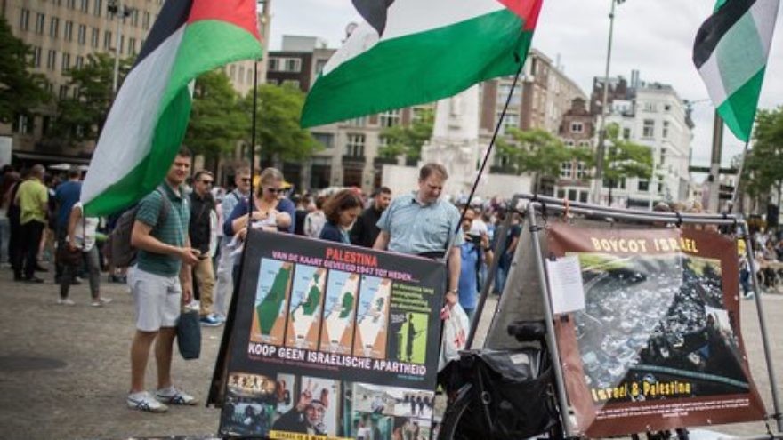 A pro-BDS display, with photos and Palestinian flags, at Dam Square in central Amsterdam June 24, 2016. Credit: Hadas Parush/Flash90.
