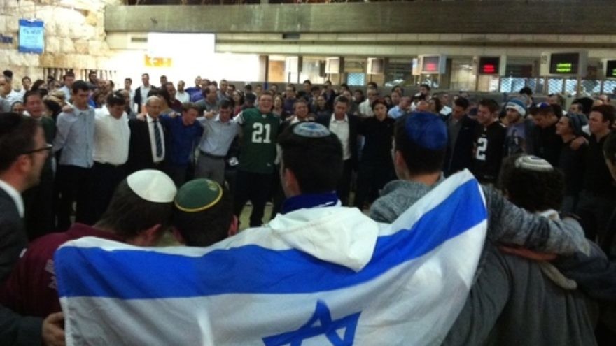Click photo to download. Caption: Saturday night's farewell ceremony for Ezra Schwartz in the old Ben Gurion Airport building in Tel Aviv. Credit: Deborah Fineblum.