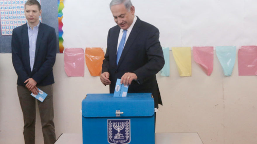 Israeli Prime Minister Benjamin Netanyahu votes in Israel's last election. Credit: Marc Israel Sellem/POOL/Flash90.