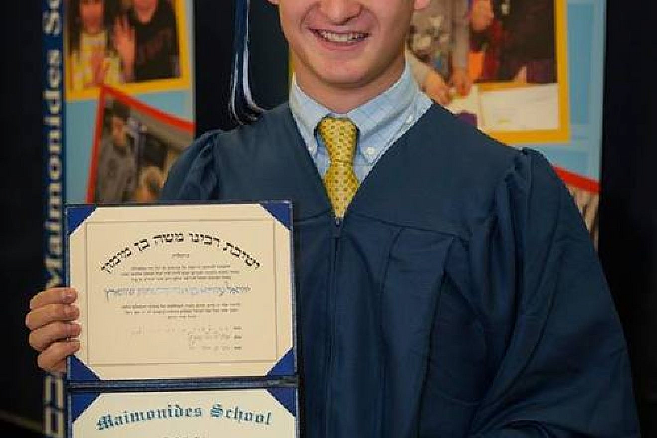 Click photo to download. Caption: Ezra Schwartz with his high school diploma from the Maimonides School in Brookline, Mass. Credit: Maimonides School via Facebook.