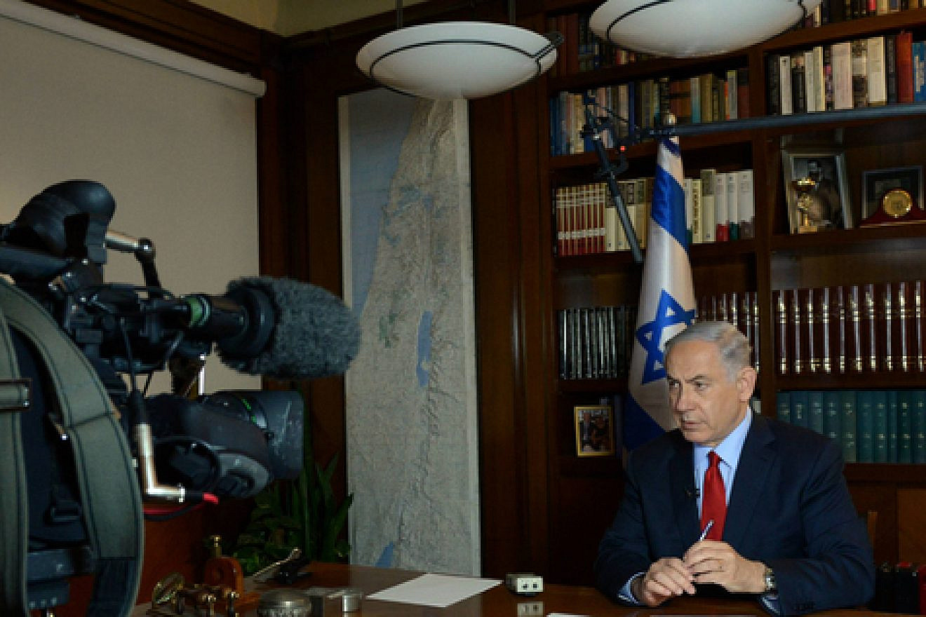Click photo to download. Caption: Israeli Prime Minister Benjamin Netanyahu gives a television interview from his office in Jerusalem on March 5, 2015. Credit: Haim Zach/GPO.