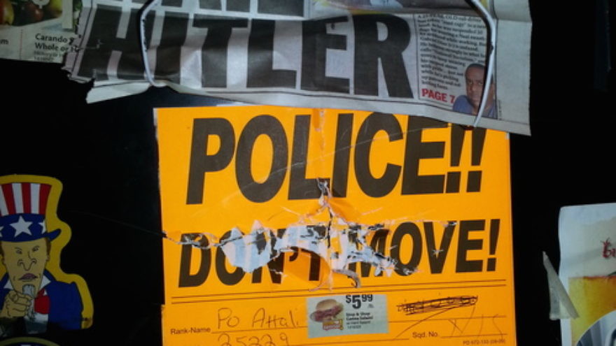 Anti-Semitic vandalism on the locker (pictured here) of former New York Police Department officer David Attali included swastikas, the words “dirty Jew,” pictures of ham or bacon (which are prohibited under Jewish dietary laws), and newspaper clippings that read: “Hail Hitler.” Credit: Courtesy.