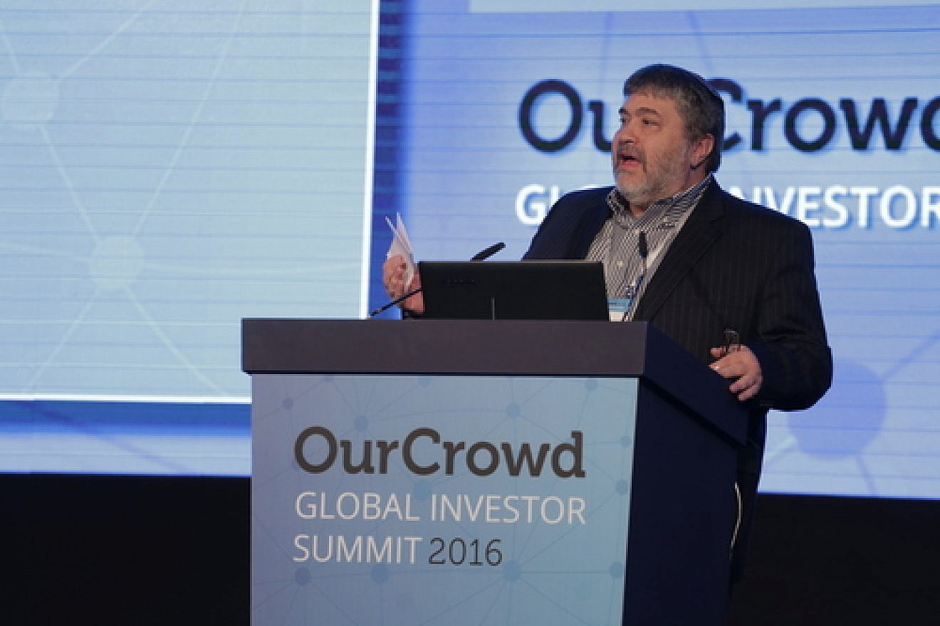 Jonathan Medved, founder and CEO of OurCrowd, the leading global-equity crowdfunding platform for accredited investors, speaks at the OurCrowd Global Investor Summit in Jerusalem. Credit: Courtesy.