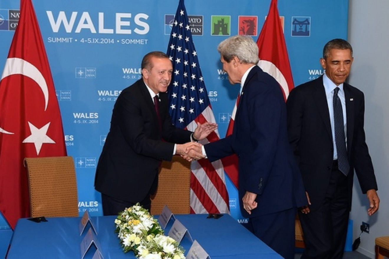 U.S. Secretary of State John Kerry shakes hands with Turkish President Recep Tayyip Erdogan before joining U.S. President Barack Obama for a bilateral meeting between the leaders on the sidelines of the NATO Summit, Sept. 5, 2014, in Newport, Wales, United Kingdom. Credit: U.S. State Department.