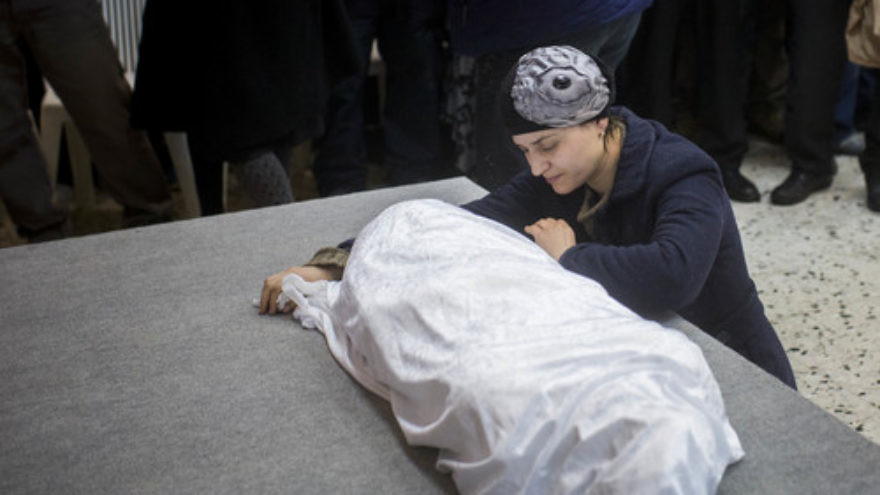 Adva Biton, mother of Adele Biton, a 4-year-old Israeli Jewish victim of a Palestinian stoning attack, cries over her daughter's body in February 2015. Photo by Yonatan Sindel/Flash90.